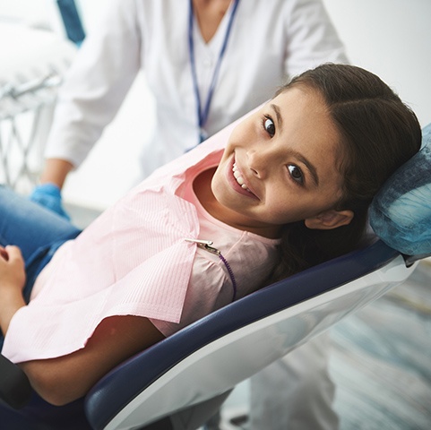 girl sitting on a dentist chair