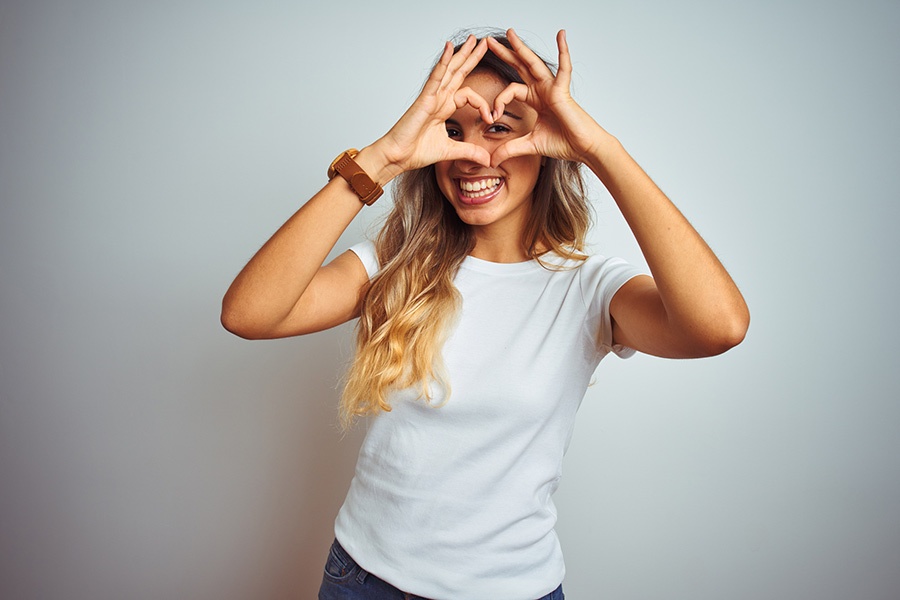 Woman Making Heart Shape With Her Hands