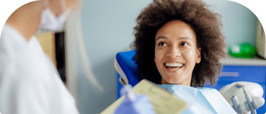 Woman in Chair Ready for dental Cleaning