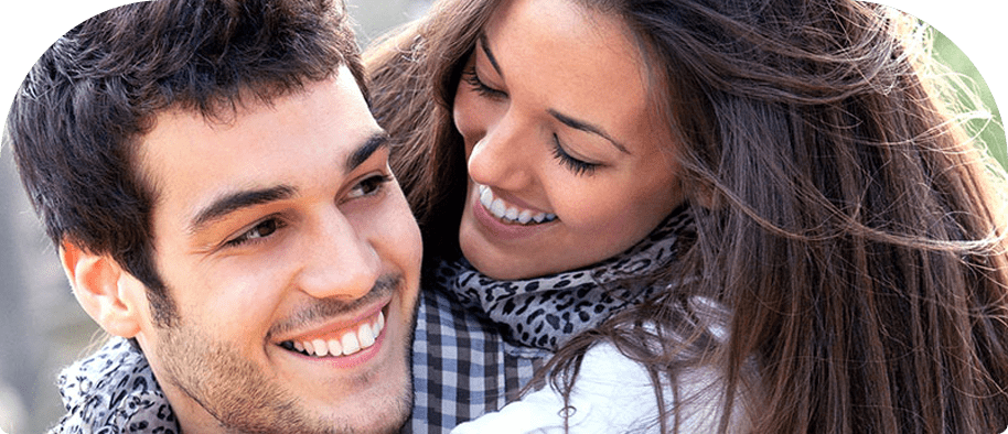smiling couple with healthy white teeth