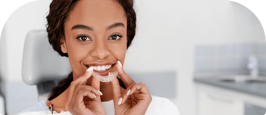 woman inserting aligners